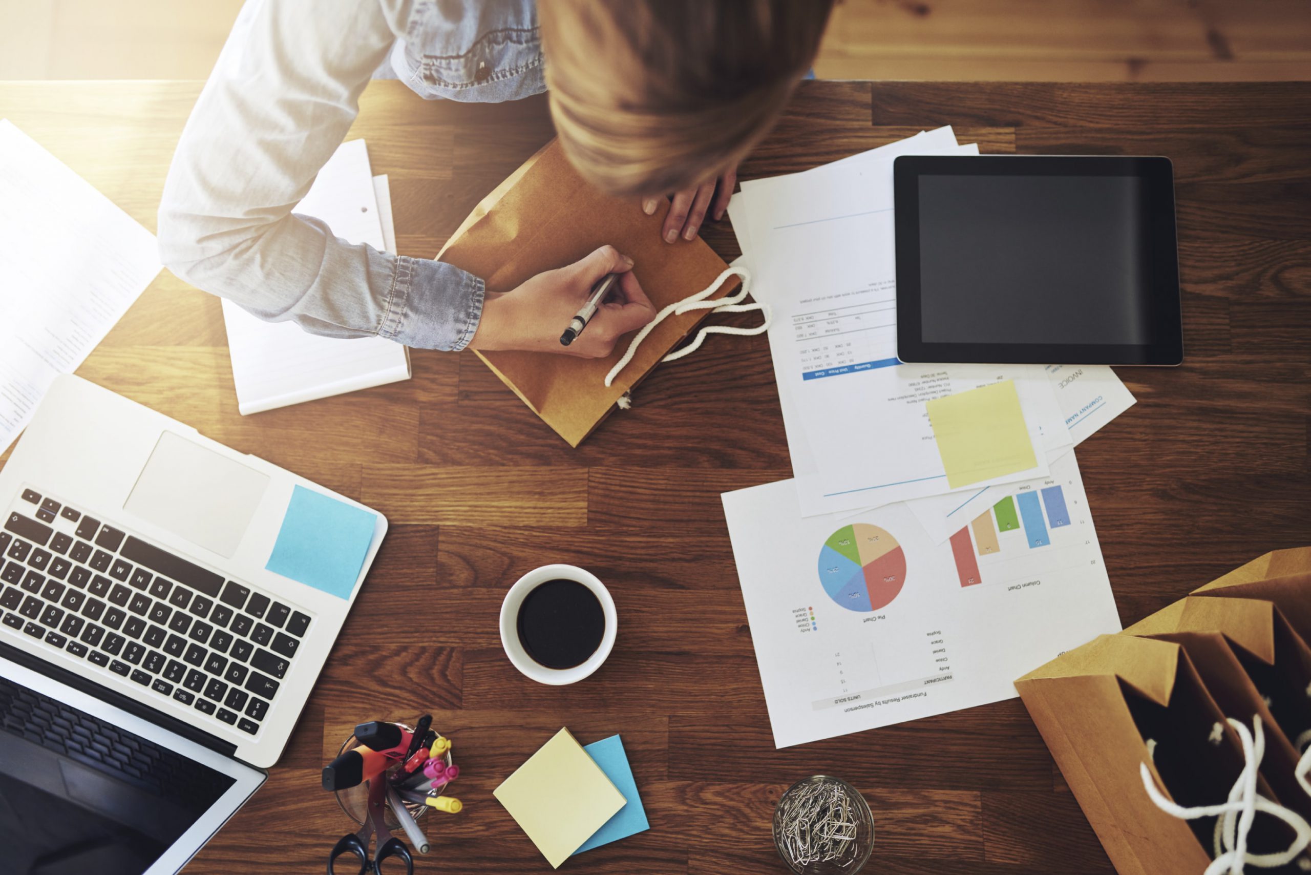 Young female entrepreneur working in a home office scaled